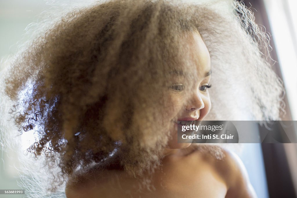 Young girl with big afro