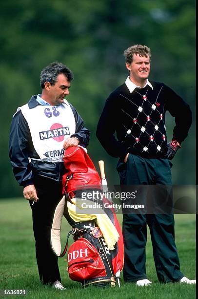 Sandy Lyle of Great Britain stands next to his caddy Dave Musgrove during a tournament. \ Mandatory Credit: Allsport UK /Allsport
