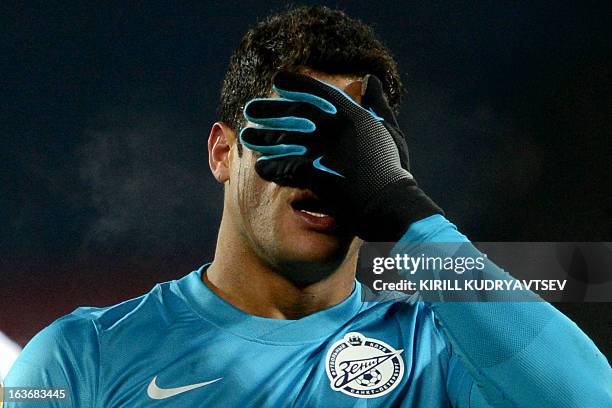 Zenit St. Petersburg's football player Hulk reacts during the UEFA Europe League round of 16 football match between FC Zenit St. Petersburg and FC...