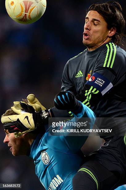 Zenit St. Petersburg's football player Nicolas Lombaerts vies for the ball with FC Basel 1893's goalkeeper Yann Sommer during their UEFA Europe...
