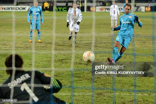 Zenit St. Petersburg's football player Roman Shirokov shoots and misses a penalty against FC Basel 1893's goalkeeper Yann Sommer during their UEFA...