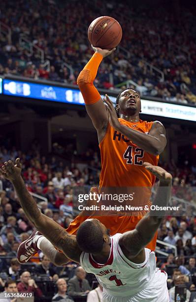 Virginia Tech's C.J. Barksdale collides with N.C. State's Richard Howell during the first half in a men's ACC basketball tournament game at the...