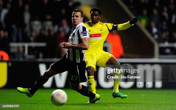 Newcastle player Steven Taylor looks on as Samuel Eto shoots wide during the UEFA Europa League Round of 16 second leg match between Newcastle United...