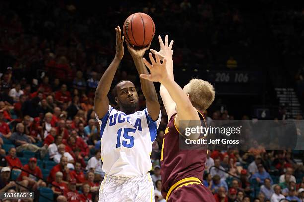 Shabazz Muhammad of the UCLA Bruins shoots the ball over Jonathan Gilling of the Arizona State Sun Devils in the second half during the quarterfinals...