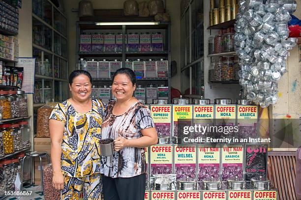 coffee sellers in front of coffee shop - vietnamese ethnicity stock pictures, royalty-free photos & images