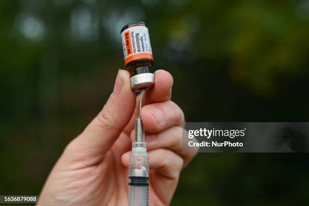 August 31, 2023: A healthcare professional explains how to administer a naloxone injection during the annual International Overdose Awareness Day, on...
