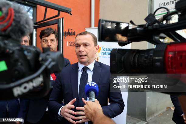 French Labour Minister Olivier Dussopt speaks to the press during his visit to the Caisse d'assurance retraite et de la santé au travail or the...