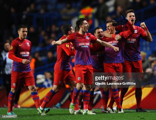 Vlad Chiriches of FC Steaua Bucuresti celebrates with team mates after scoring their first goal during the UEFA Europa League Round of 16 Second leg...