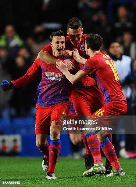 Vlad Chiriches of FC Steaua Bucuresti celebrates with team mates after scoring their first goal during the UEFA Europa League Round of 16 Second leg...