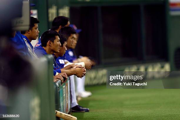 Members of Team Chinese Taipei look on from the dugout during Pool 1, Game 3 between the Chinese Taipei and Cuba in the second round of the 2013...