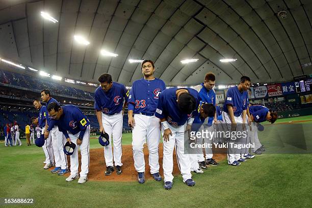 Members of Team Chinese Taipei thank the crowd after being eliminated from the 2013 World Baseball Classic after being defeated by Team Cuba in Pool...