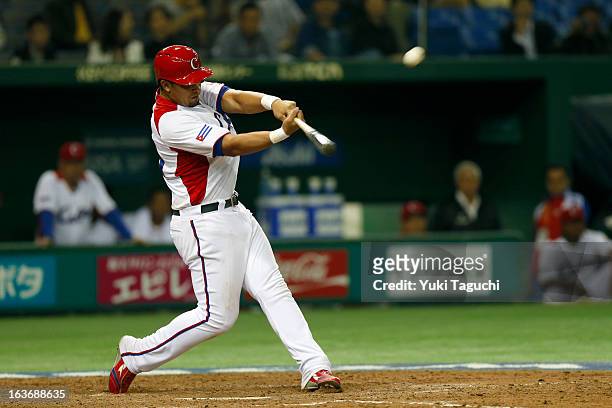 Jose Abreu of Team Cuba hits a two run home run in the bottom of the sixth inning during Pool 1, Game 3 between the Chinese Taipei and Cuba in the...