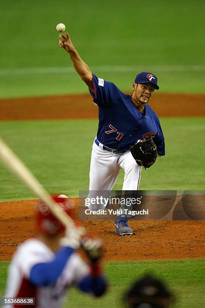 Ching-Lung Lo of Team Chinese Taipei pitches during Pool 1, Game 3 between the Chinese Taipei and Cuba in the second round of the 2013 World Baseball...