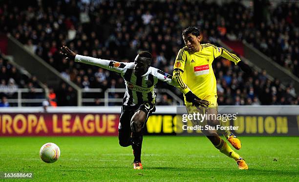 Newcastle player Massadio Haidara is challenged by Joao Carlos during the UEFA Europa League Round of 16 second leg match between Newcastle United FC...