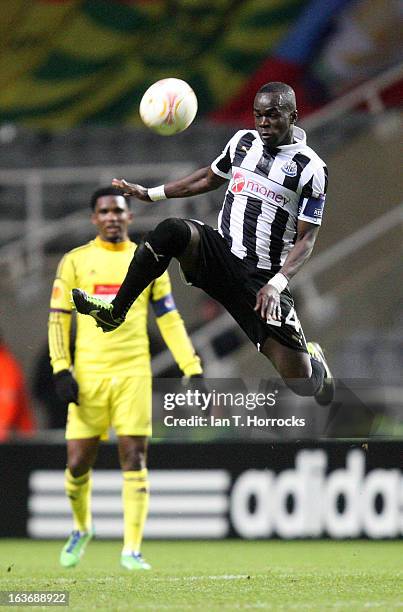 Cheik Tiote of Newcastle United jumps for the ball during the UEFA Europa League Round of 16 second leg match between Newcastle United FC and FC Anji...