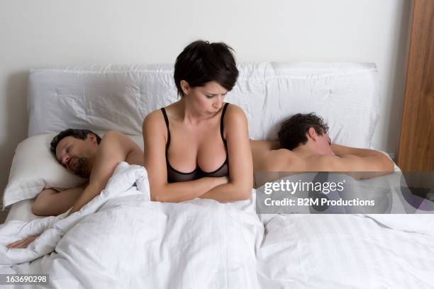 woman sitting between two men - men wearing bras photos stock pictures, royalty-free photos & images