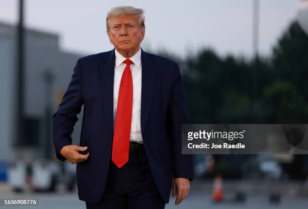 Former U.S. President Donald Trump arrives to depart at Atlanta Hartsfield-Jackson International Airport after being booked at the Fulton County jail...