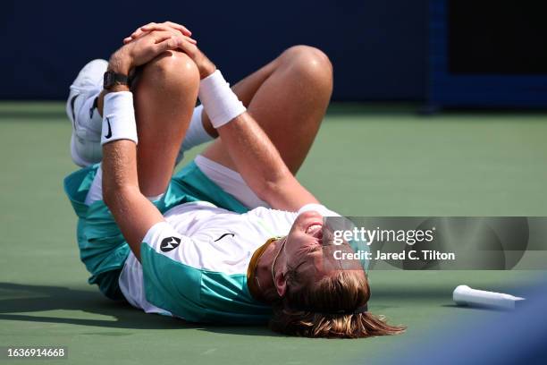 Sebastian Korda of the United States reacts after falling to the court during a quarterfinals match against Richard Gasquet of France in the...