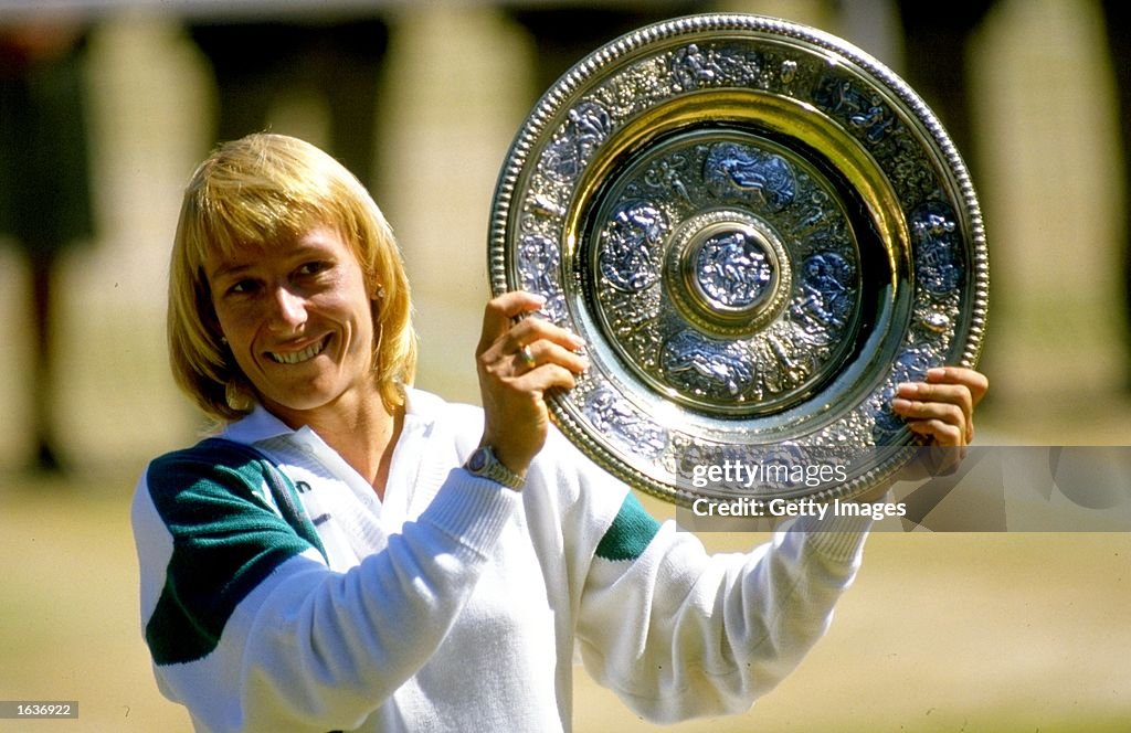 Martina Navratilova of the USA holds up the winner plate after winning