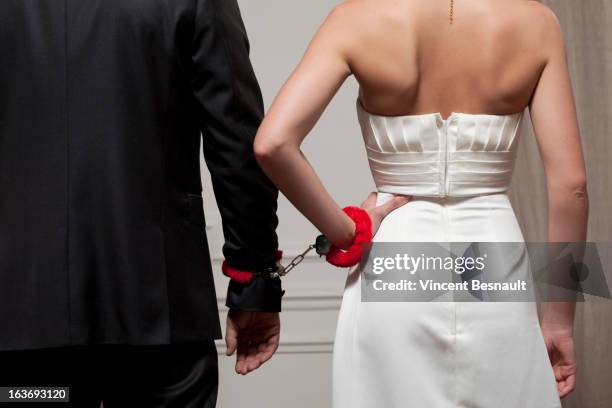 handcuffs - married handcuffs stock pictures, royalty-free photos & images