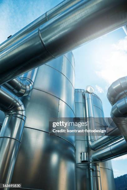 a pufferspeicher blockheizkraftwerk of a biogas in germany - biomass power plant stock pictures, royalty-free photos & images