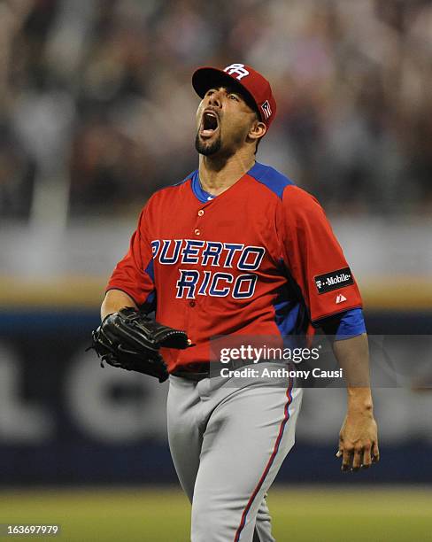 Romero of Team Puerto Rico reacts to striking out Pablo Sandoval of Team Venezuela to end the eighth inning during Pool C, Game 4 in the first round...