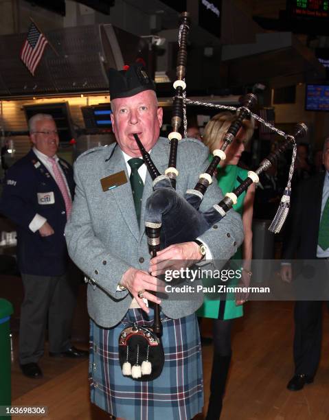 Joe Brady plays the bag pipes on the floor of the at the New York Stock Exchange on March 14, 2013 in New York City.