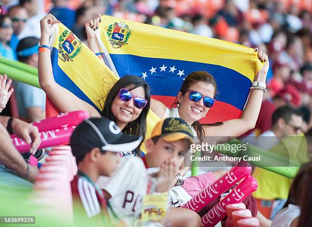 Fans are seen with Venezuelan flags in the stands during Pool C, Game 5 between Spain and Venezuela in the first round of the 2013 World Baseball...
