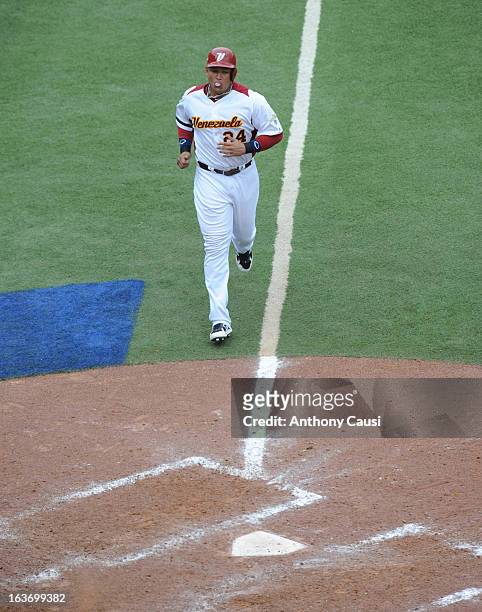 Miguel Cabrera of Team Venezuela scores a run in the bottom of the sixth inning during Pool C, Game 5 against Spain in the first round of the 2013...