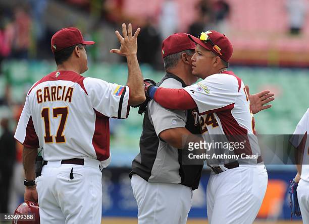 Miguel Cabrera of Team Venezuela hugs coach Andres Galarraga after defeating Team Spain in Pool C, Game 5 in the first round of the 2013 World...