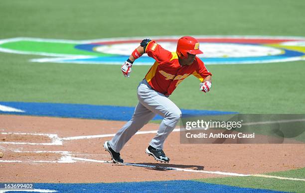 Yasser Gomez of Team Spain runs to first base during Pool C, Game 5 against Venezuela in the first round of the 2013 World Baseball Classic at Hiram...