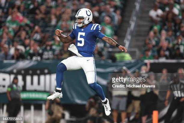 Anthony Richardson of the Indianapolis Colts jumps in the air as he reacts during to an NFL preseason game at Lincoln Financial Field on August 24,...