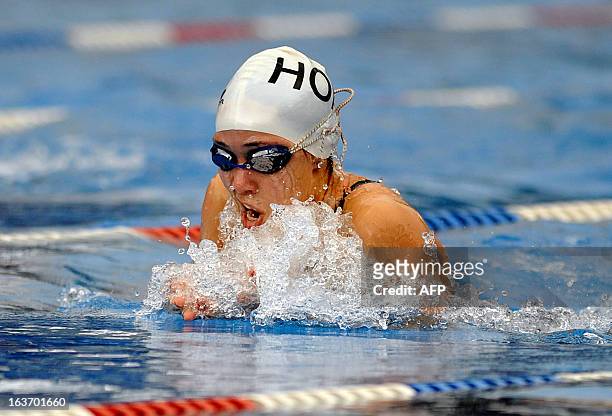 Honduran swimmer Ana Maria Castellanos competes in the women's 100 m breaststroke final during the 10th Central American Games in San Jose, on March...