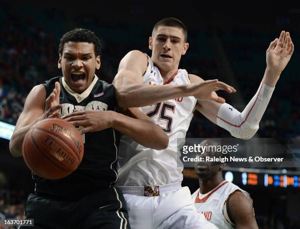 Wake Forest forward Devin Thomas loses the handle on the ball as Maryland center Alex Len defends during the first half in a men's ACC basketball...