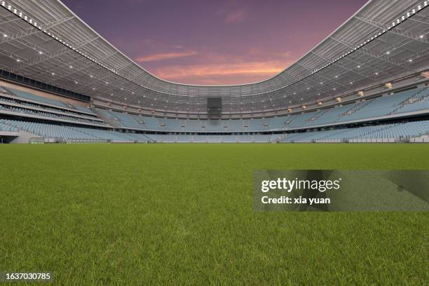 an empty soccer stadium at sunset - china football stock pictures, royalty-free photos & images