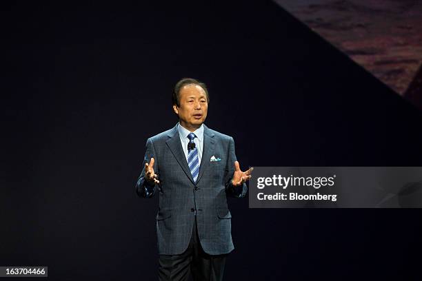 Shin, head of Samsung Electronics Co.'s mobile division, unveils the new Galaxy S4 smartphone during an event at Radio City Music Hall in New York,...