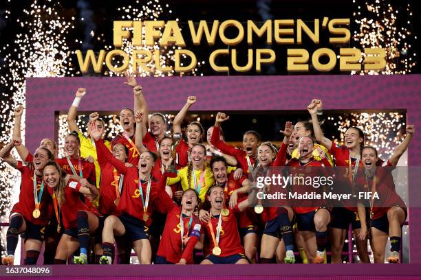 Ivana Andres of Spain and teammates celebrate with the FIFA Women's World Cup Trophy following victory in the FIFA Women's World Cup Australia & New...