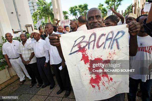 People from the Comoros demonstrate in front of the Courthouse in Saint Denis, on the French island of La Reunion, on March 29 against the ousted...