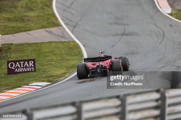 Rear view with sparkles of Carlos Sainz of Spain driving the car no 55, the Ferrari SF-23 of Scuderia Ferrari F1 Team on track during the Dutch GP...