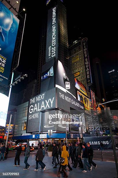 Samsung Electronics Co. Signage is displayed on billboards during the release of the Samsung Electronics Co. Galaxy S4 smartphone in Times Square in...