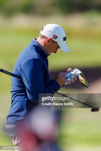 James McGhee makes notes in his yardage book on the Final Day of the Loch Lomond Whiskies Scottish PGA Championship at Scotscraig Golf Club on...