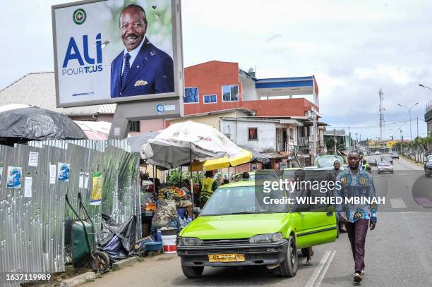 General view of a torn campaign billboard of ousted Gabon President Ali Bongo Ondimba in Libreville on September 1, 2023. Gabon's new strongman...