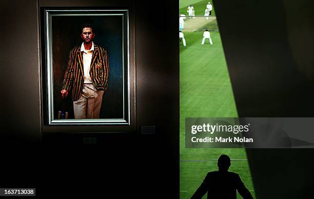 Portrait of Ricky Ponting is displayed in the foyer of the Tasmanian Cricket Museum as a man watches play during day two of the Sheffield Shield...
