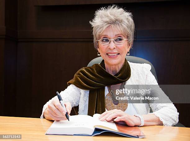 Rita Moreno signs her book during her Book Signing For "Rita Moreno: A Memoir" at Barnes & Noble bookstore at The Grove on March 14, 2013 in Los...