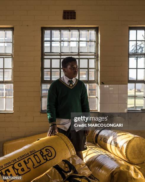 Sphesihle Ayasanda Mbatha from the Jabulani Technical Secondary School U16 rugby team poses for a portrait at the school in Soweto, on May 25, 2023.