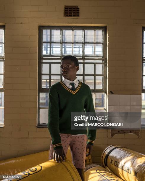 Ntobeko Mhlungu from the Jabulani Technical Secondary School U16 rugby team poses for a portrait at the school in Soweto, on May 25, 2023.