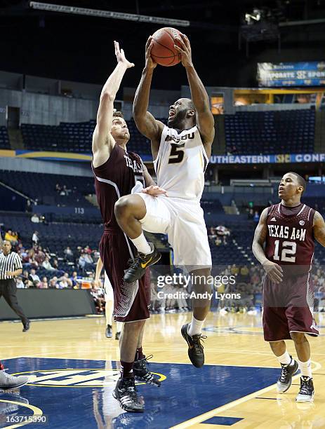 Keion Bell of the Missouri Tigers shoots the ball during the game against the Texas A&M Aggies in the second round of the SEC Basketball Tournament...