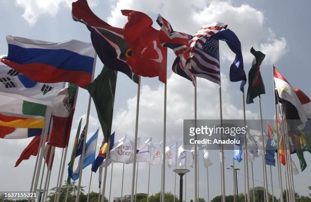 The flags of participating countries wave outside the Bharat Mandapam at ITPO Convention Centre ahead of the G20 India Summit in New Delhi, India on...