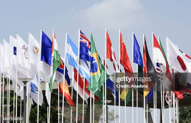 The flags of participating countries wave outside the Bharat Mandapam at ITPO Convention Centre ahead of the G20 India Summit in New Delhi, India on...