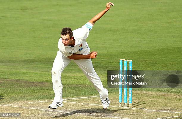 Evan Gulbis of Tasmania bowls during day two of the Sheffield Shield match between the Tasmania Tigers and the Victoria Bushrangers at Blundstone...